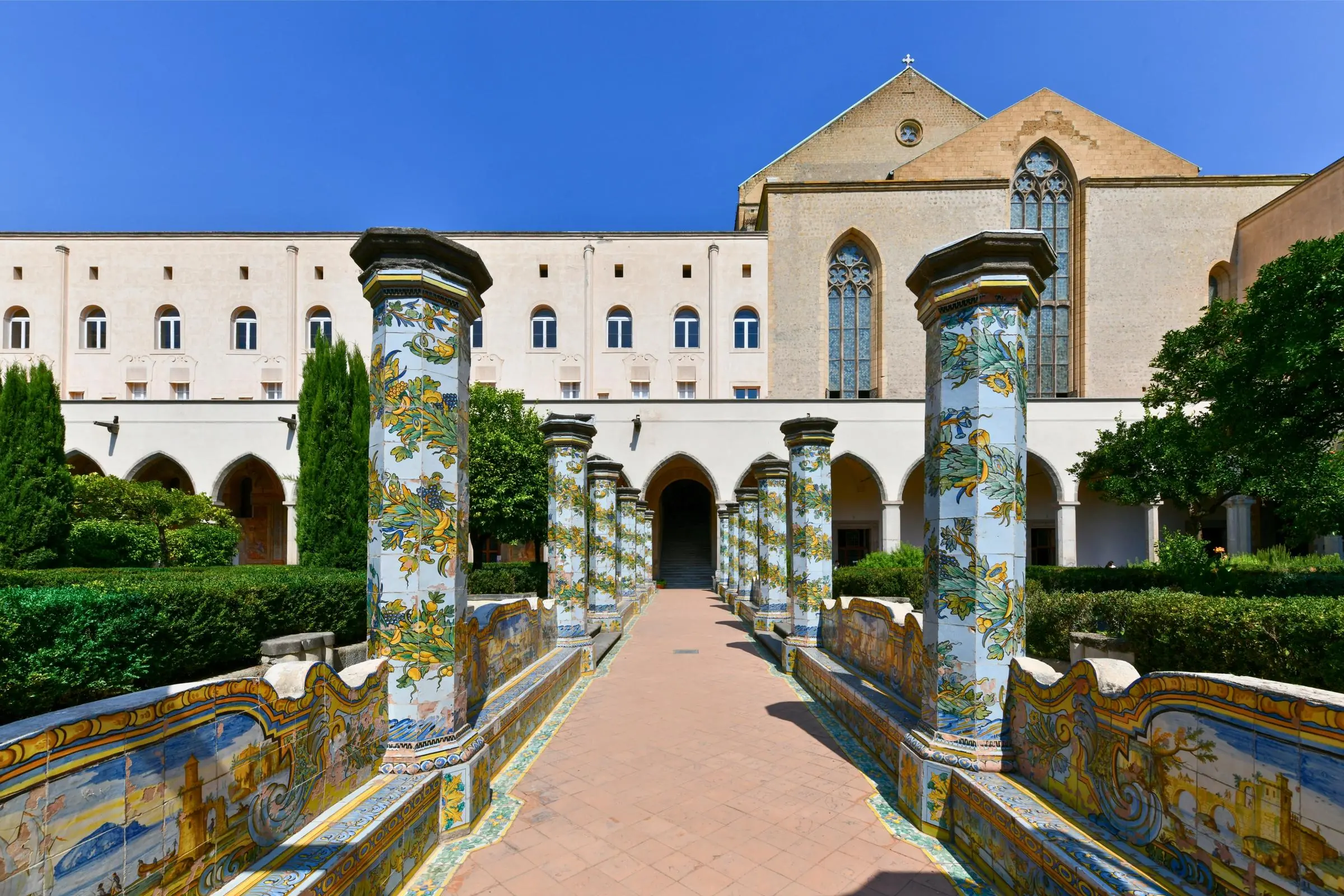 The vibrant Majolica-tiled pillars of the Santa Chiara Cloister in Naples
